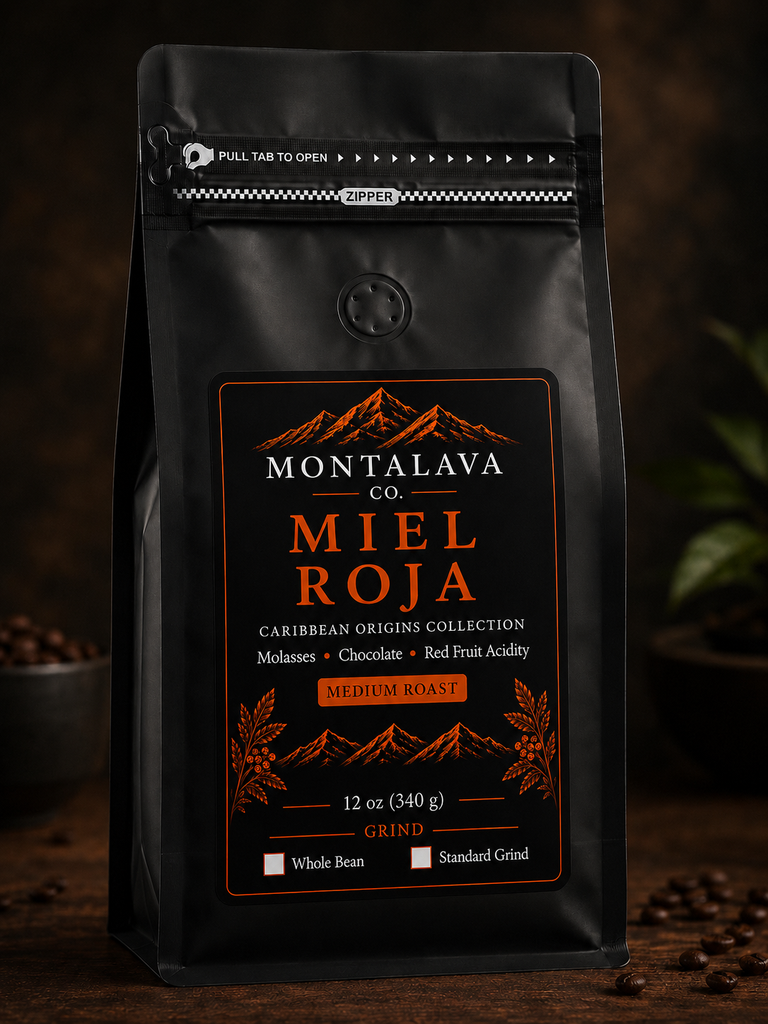 A black stand-up coffee bag labeled Montalava Co. Miel Roja, standing on a dark wooden surface with coffee beans around it.